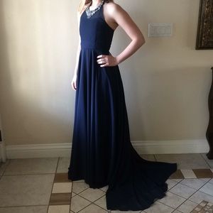 Navy blue gown with silver embellishments.